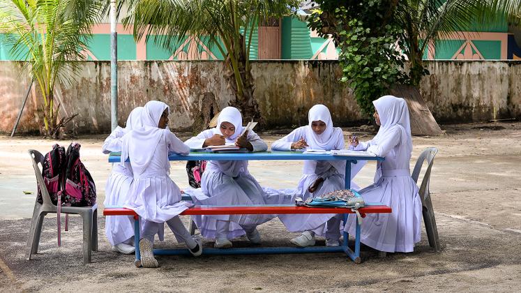 Female students studying outside